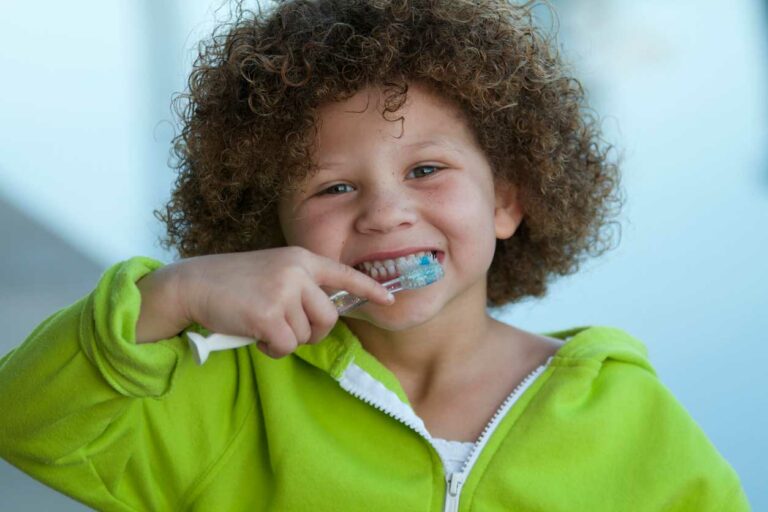 child brushing their teeth